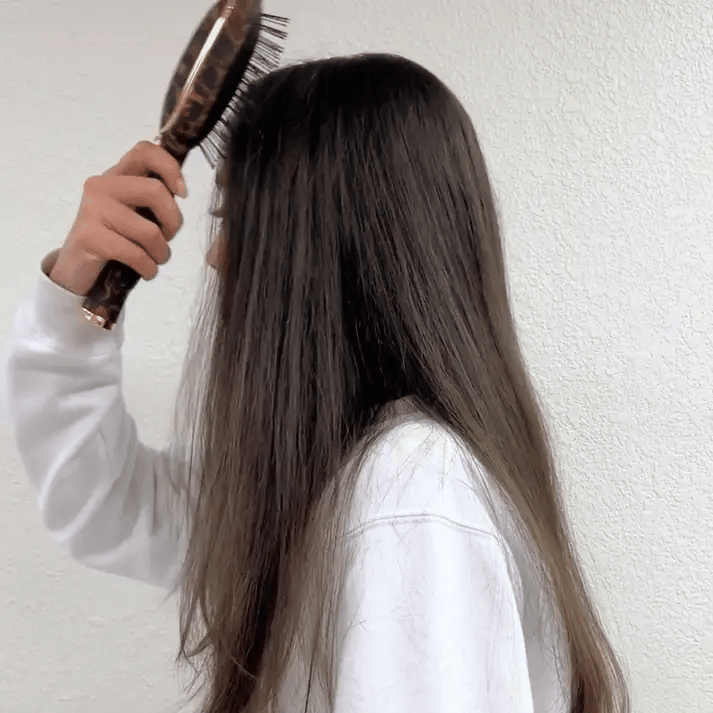 Video of girl combing her hair