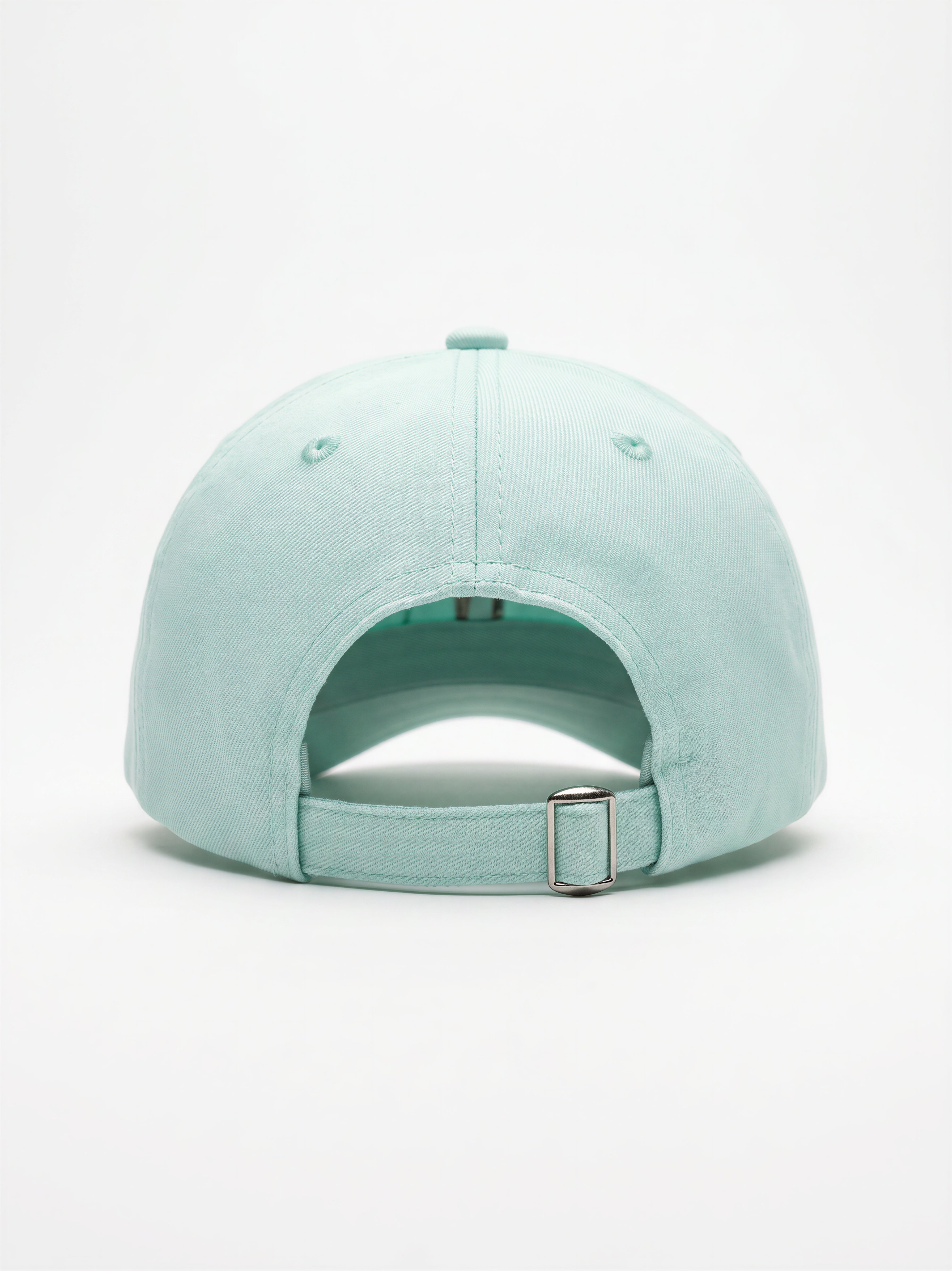 Mialur Boutique - A mint green baseball cap shown from the back, featuring a curved crown, ventilation eyelets, and an adjustable strap with a silver metal buckle, set against a plain white background.