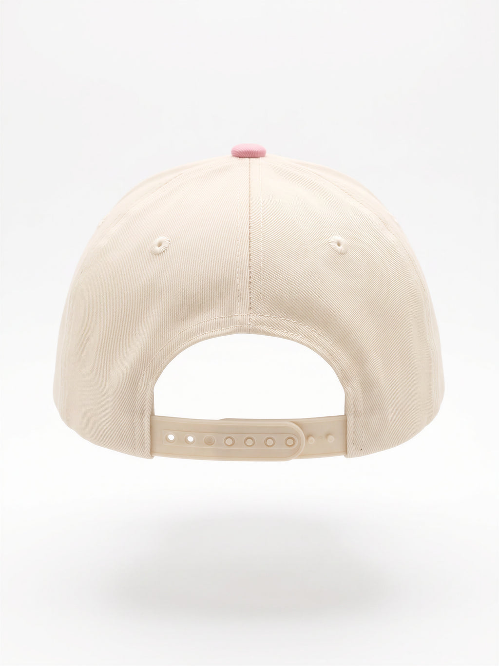 Mialur Boutique - The back view of a beige baseball cap with an adjustable strap and a small pink button on top, shown against a plain white background.