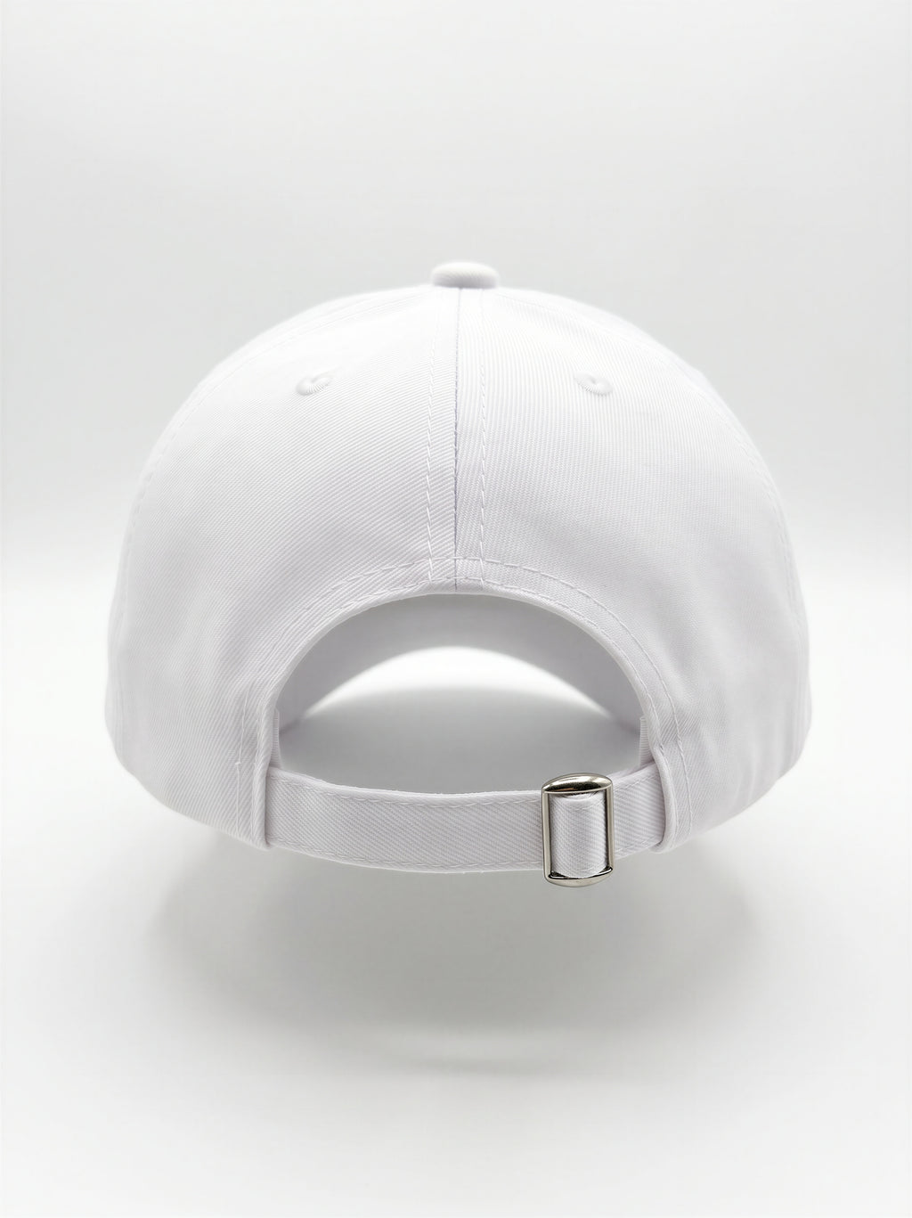 Mialur Boutique - White baseball cap shown from the back, featuring a curved crown, an adjustable fabric strap, and a silver metal buckle, set against a seamless white studio background.