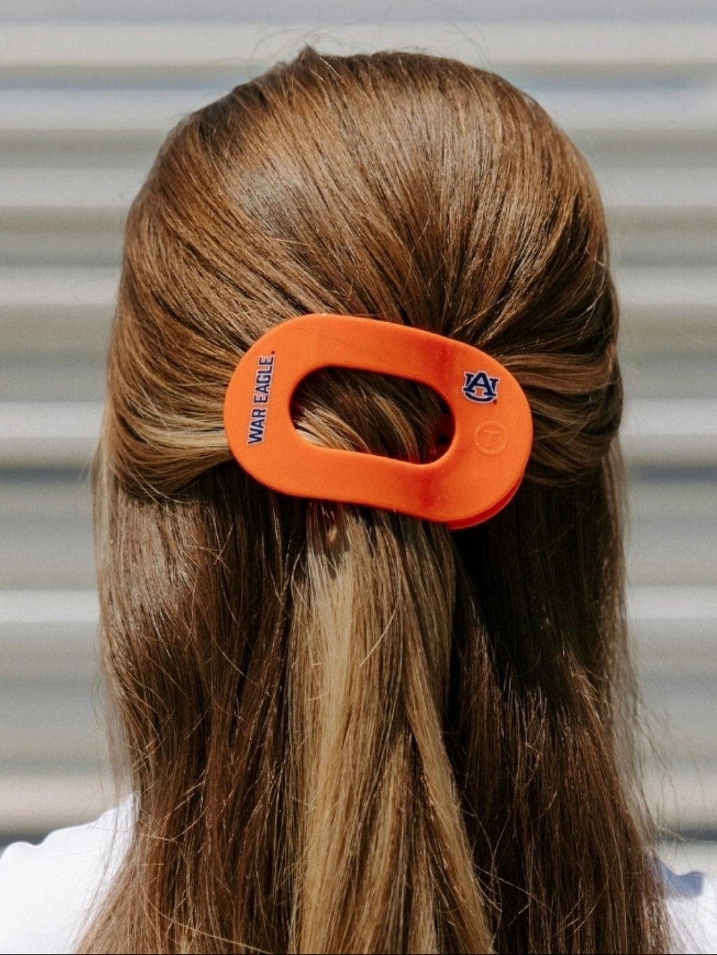 Mialur Auburn University War Eagle medium flat round hair clip in orange worn in brown hair