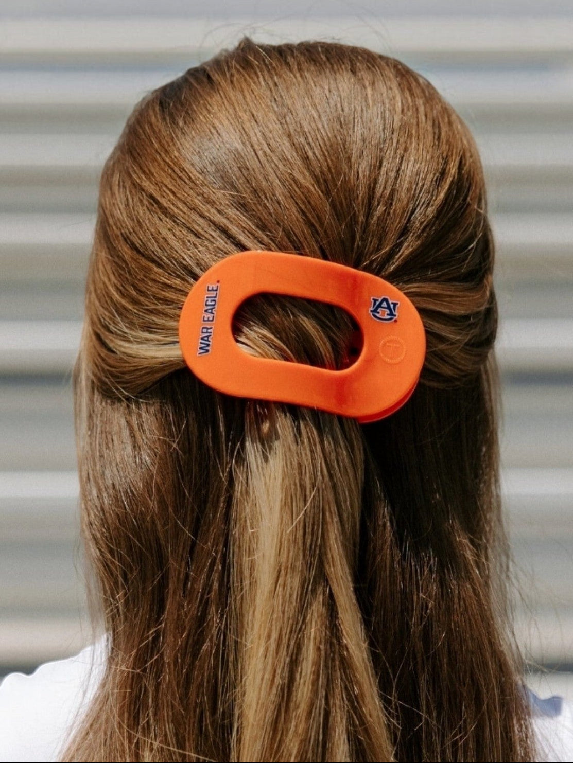 Mialur Auburn University War Eagle medium flat round hair clip in orange worn in brown hair
