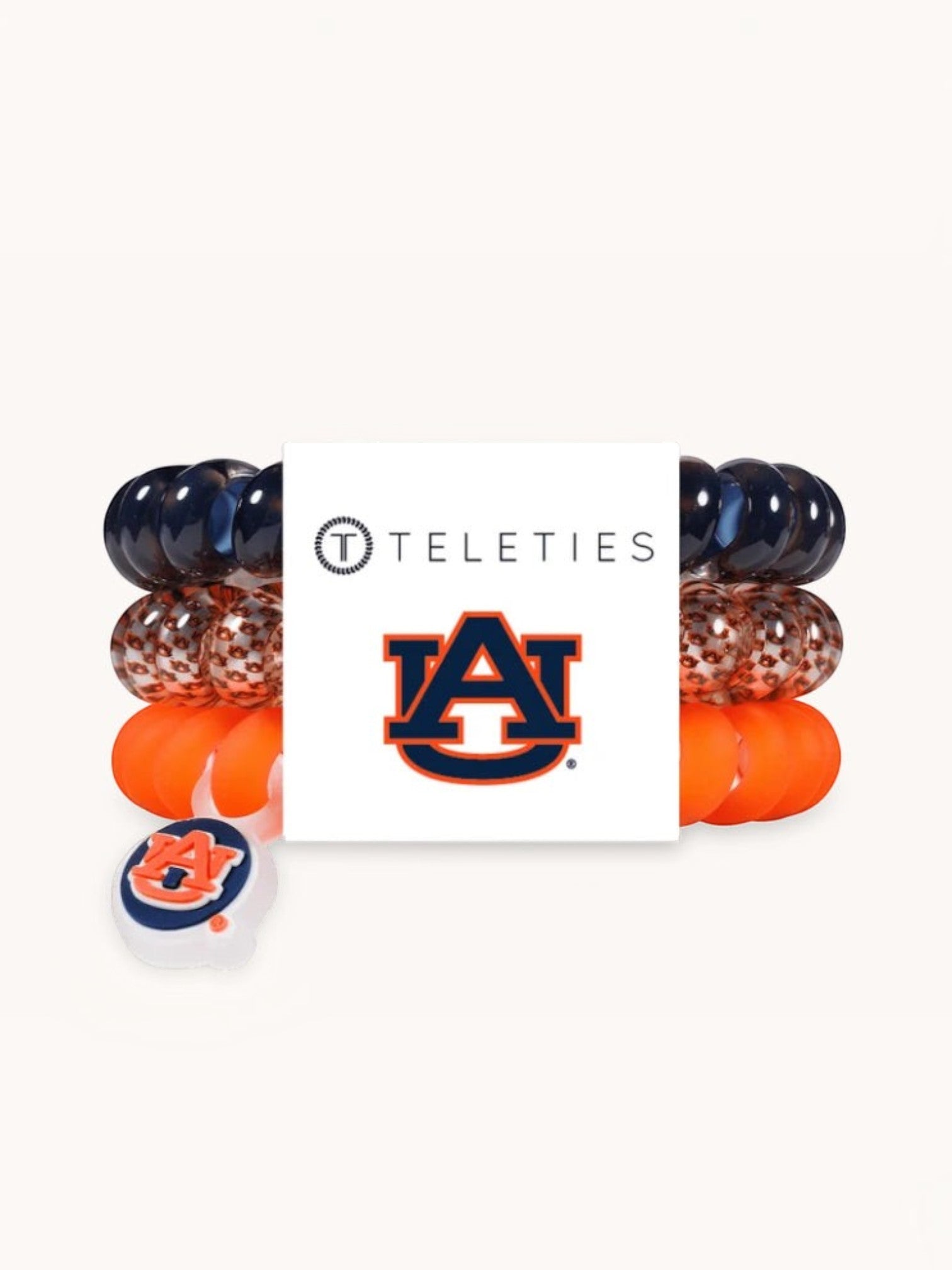 Mialur TELETIES Auburn University hair ties in orange and navy with a team logo charm on a white display card