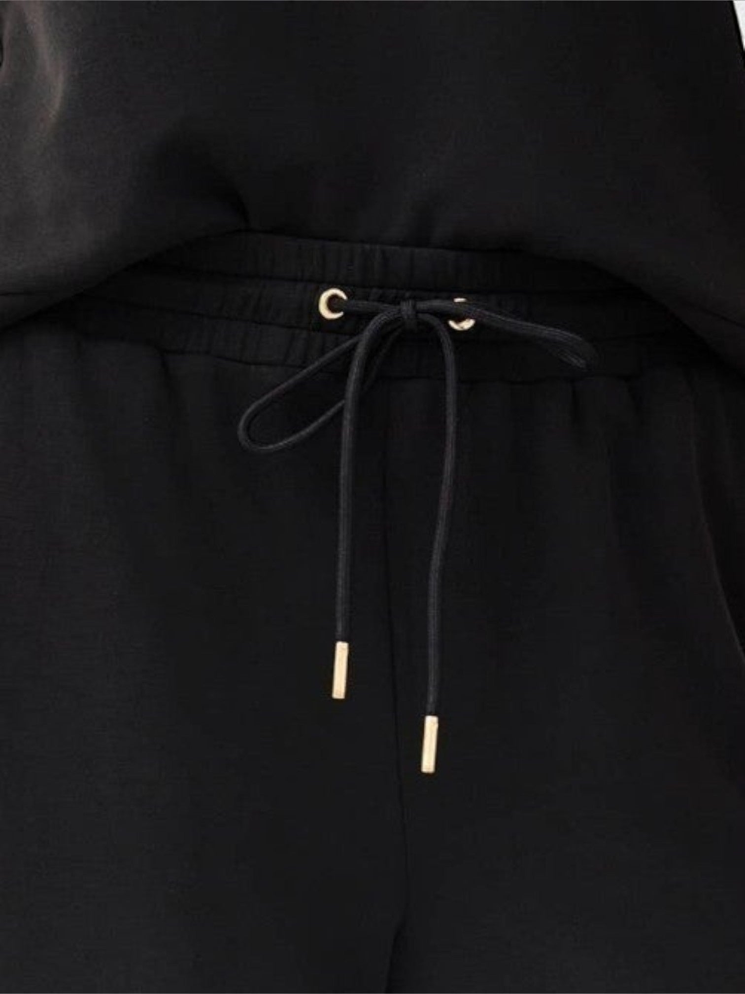 Mialur Avery black cropped wide-leg pants featuring an adjustable drawstring waistband with gold-toned metal tips.