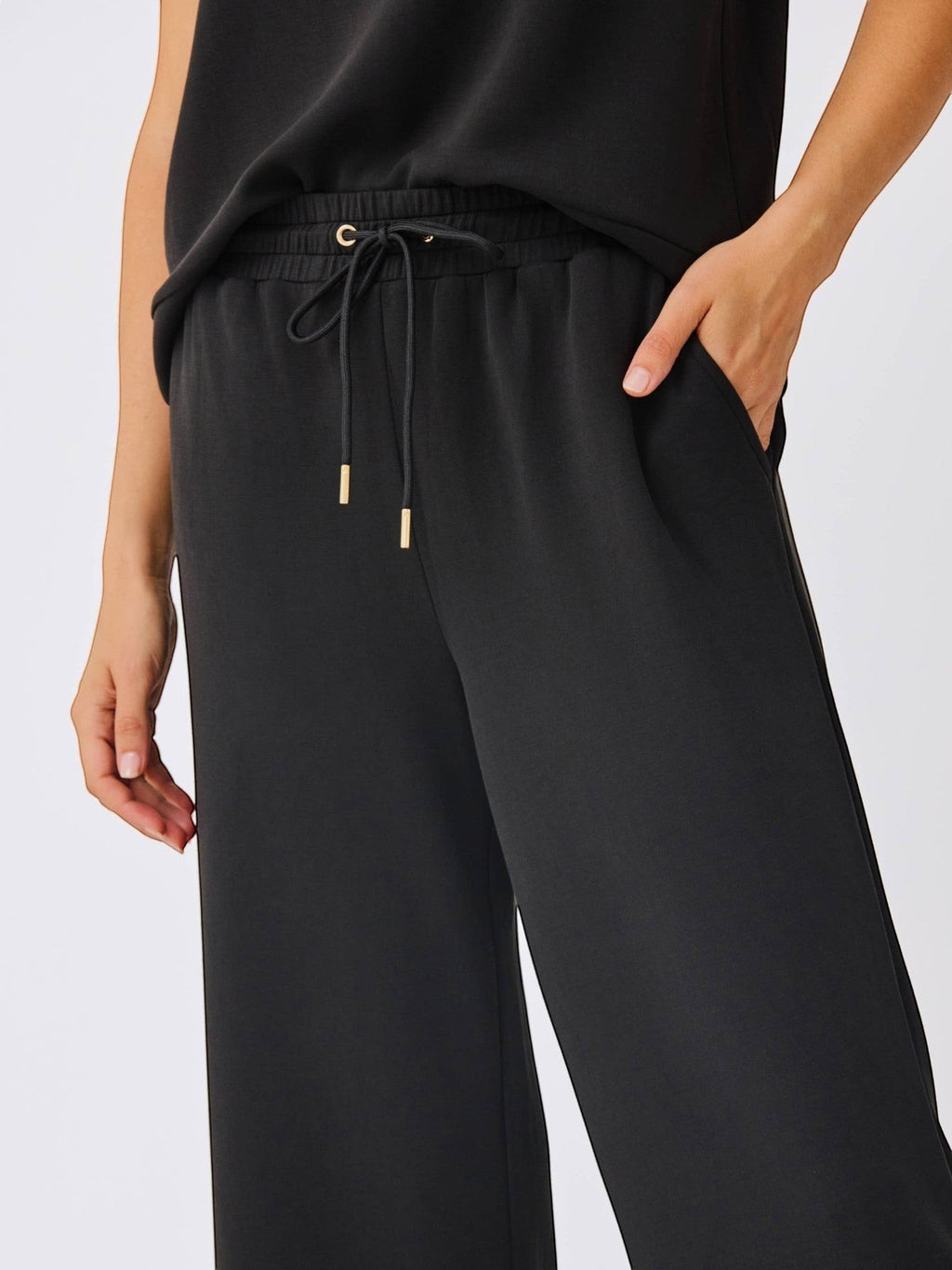 Mialur black Avery cropped wide-leg pants in soft modal blend with an adjustable drawstring waistband and side pockets.