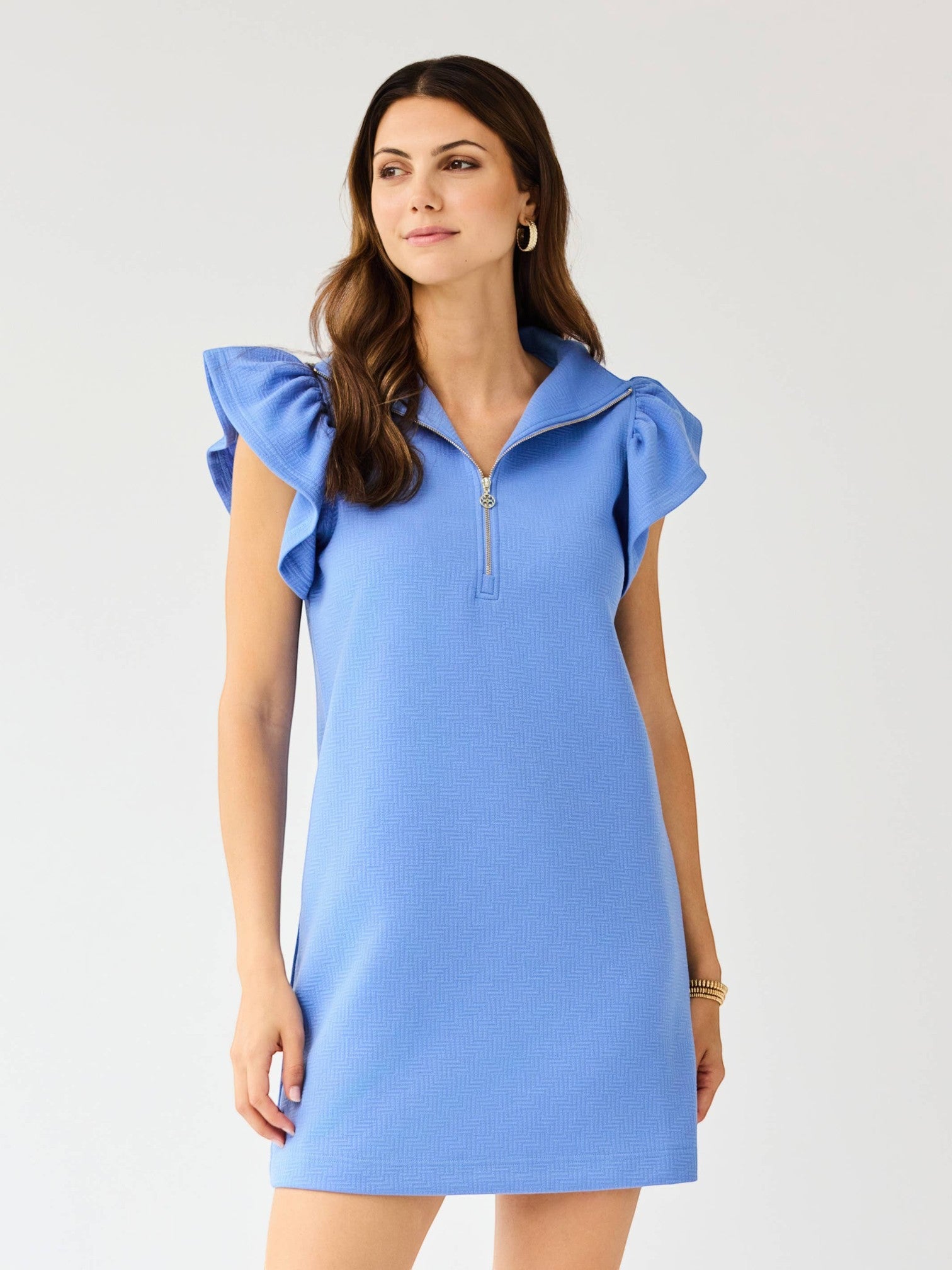 Model wearing a Mialur light blue mini dress with flutter ruffle sleeves, a half-zip collar, and textured fabric.
