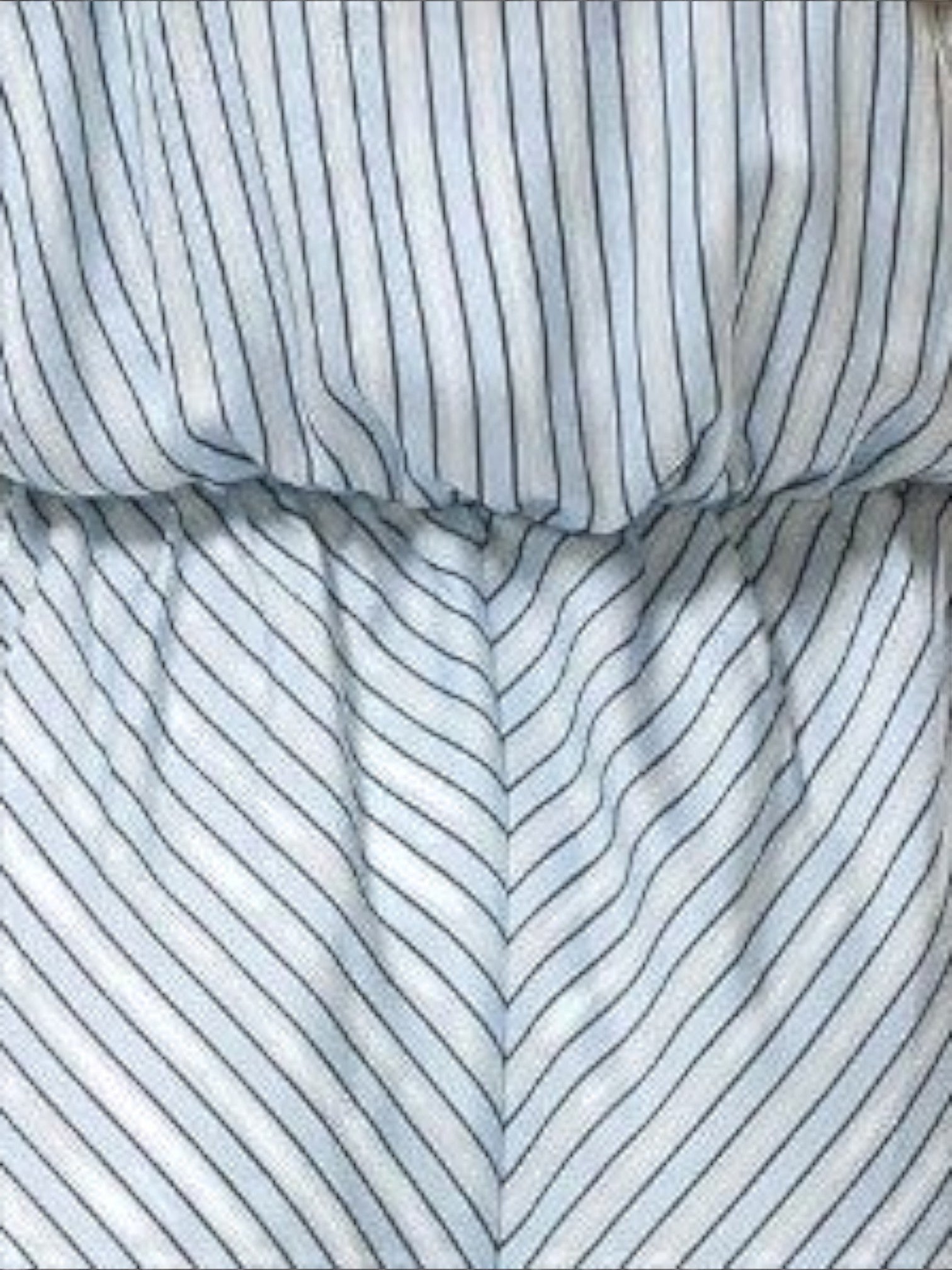 Mialur Bluebell Romper featuring blue and white vertical striped fabric with a relaxed, flowy fit.