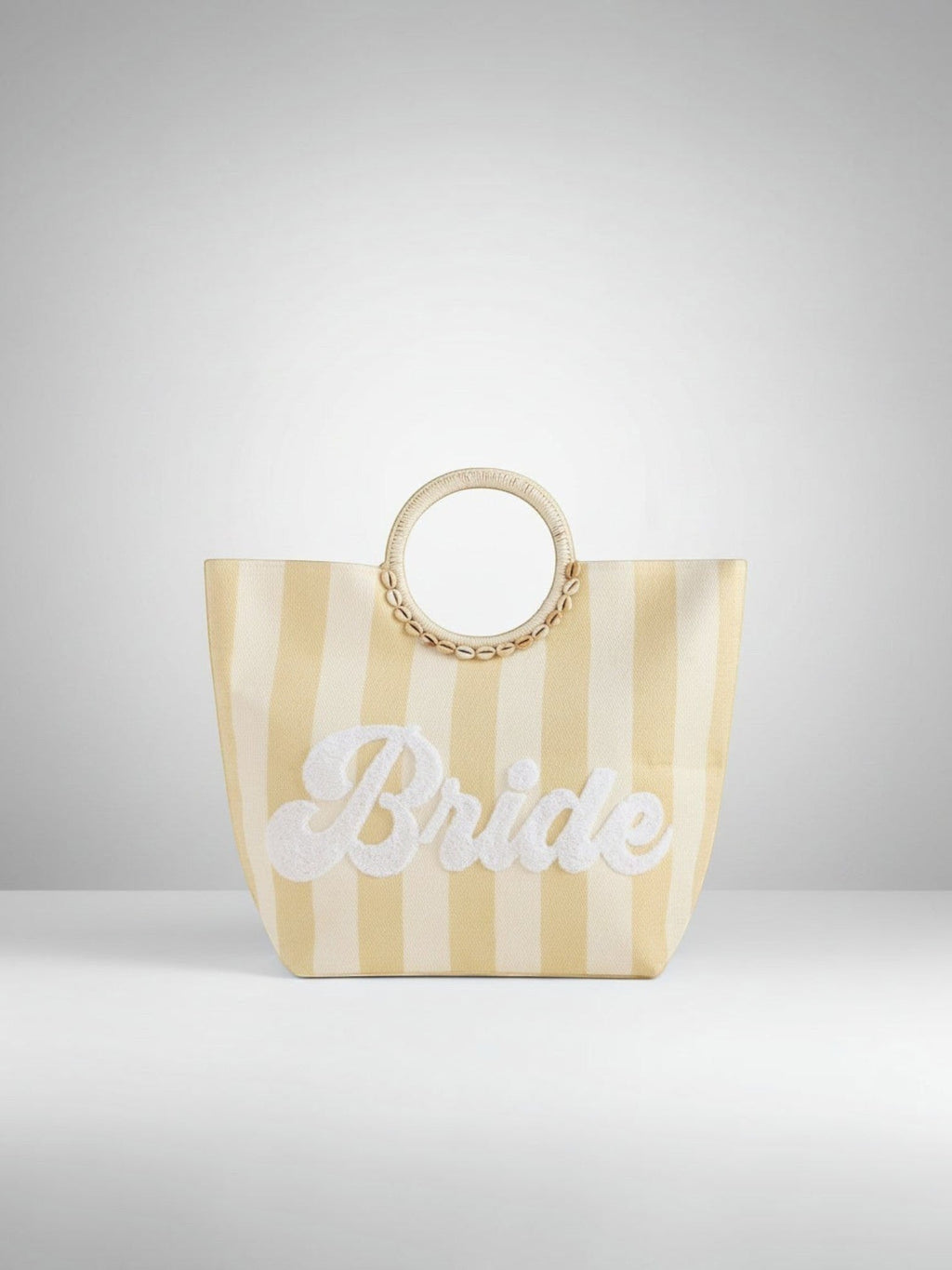 Mialur cream and soft yellow striped straw tote bag with Bride embroidery and shell-accented round handles