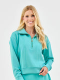 Mialur coastal blue half-zip pullover with an oversized collar and gold zipper worn by a blonde woman