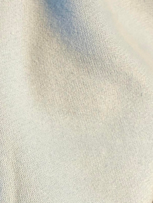 Mialur Cool Mom mock neck top sleeve detail featuring light blue fabric and a ribbed cuff