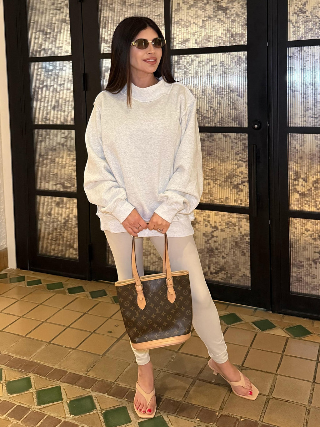 Mialur Cool Mom mock neck reversible sweatshirt in light grey worn by a woman with sunglasses and a designer bag.