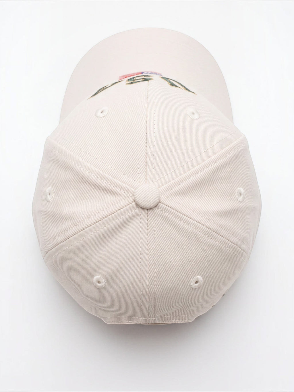 Top view of a cream Mialur baseball hat with embroidered USA lettering and an American flag detail on the curved brim.