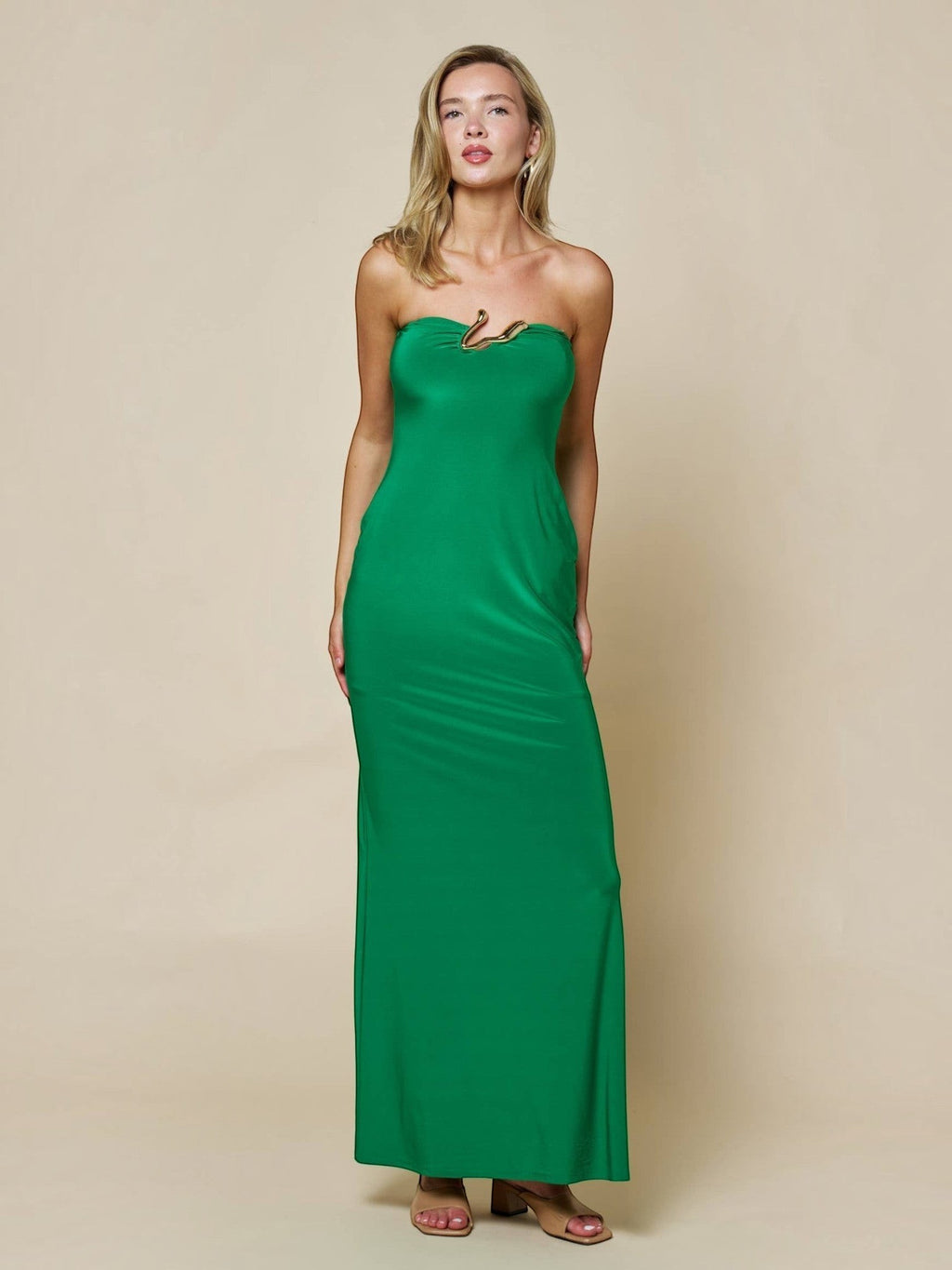 Mialur emerald green strapless maxi dress with gold-tone abstract neckline hardware on a model