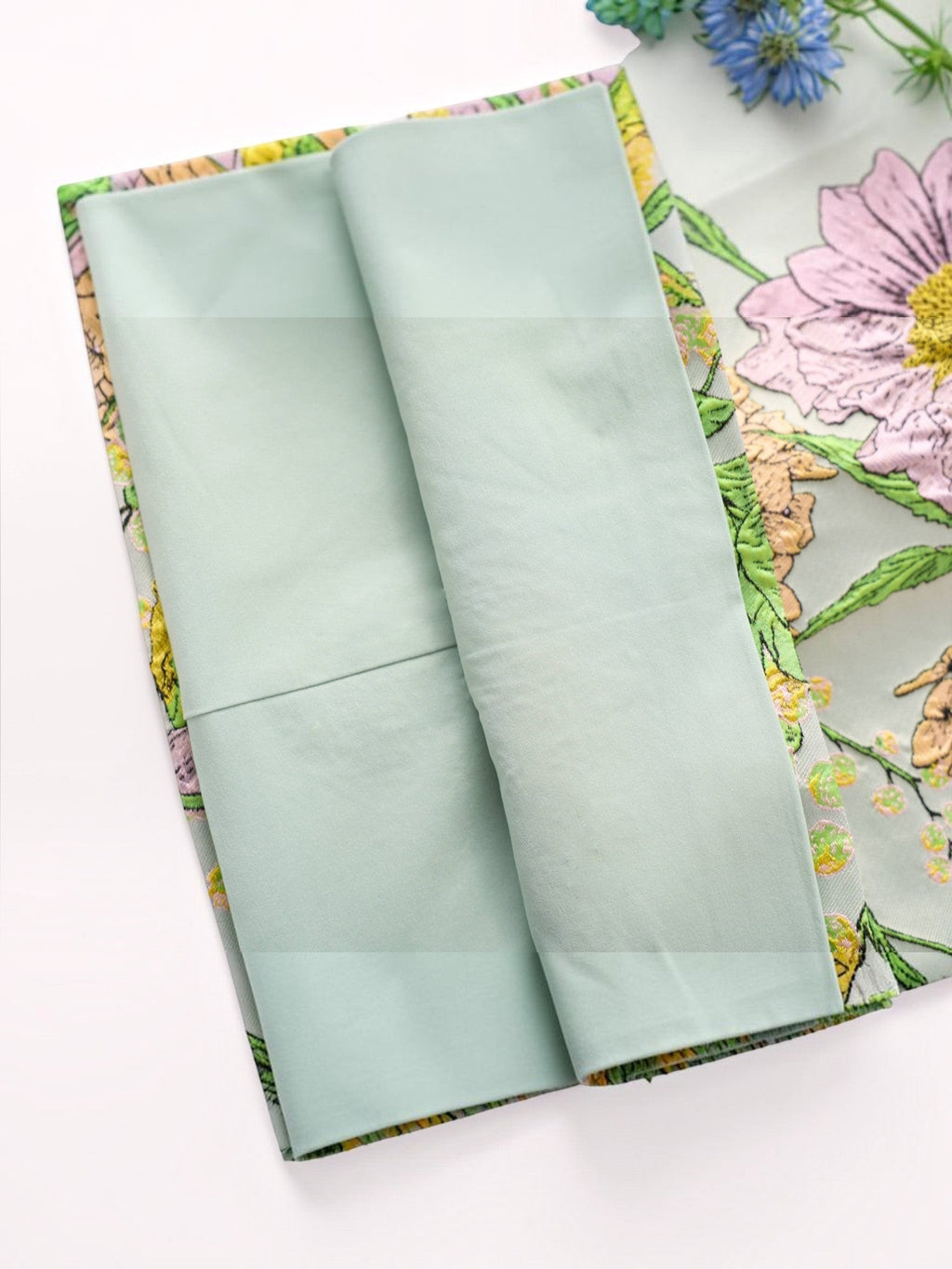 Mialur The Flora Mini Dress in sage green with lavender and golden botanical floral print and smooth inner lining