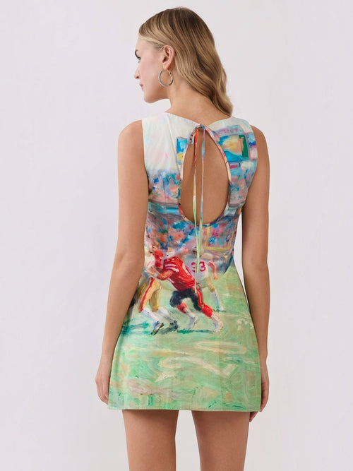 Mialur mini dress with abstract football game print, featuring a round neckline and an open-back keyhole with tie detail.