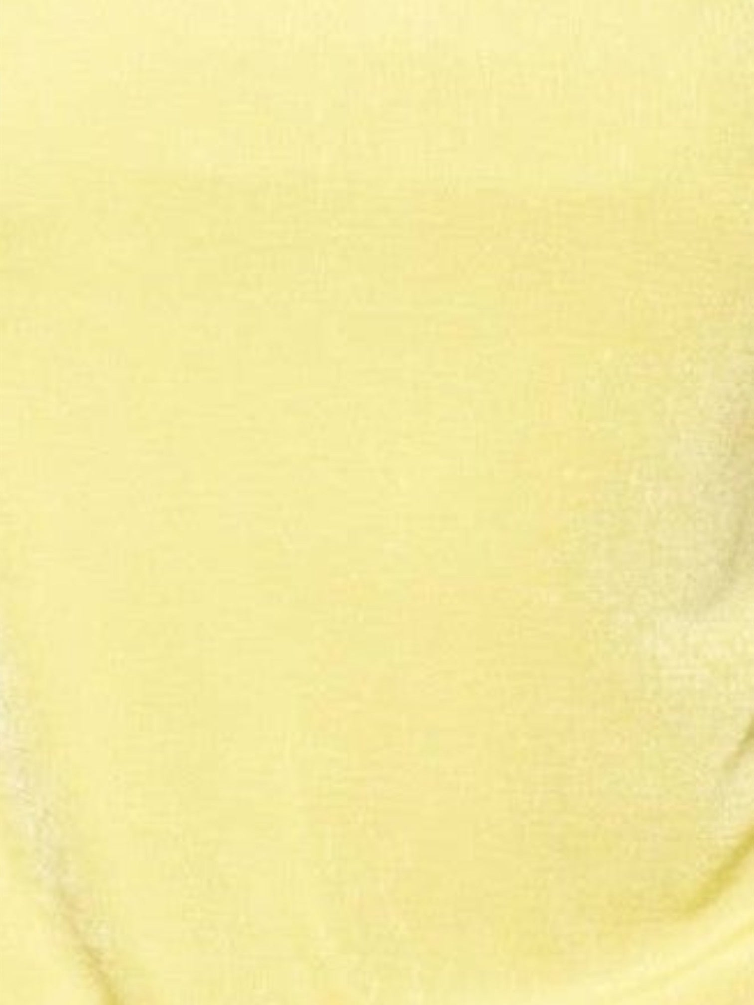Close-up of the vibrant sunshine yellow fabric of the Mialur Golden Hour mini dress featuring a soft texture.