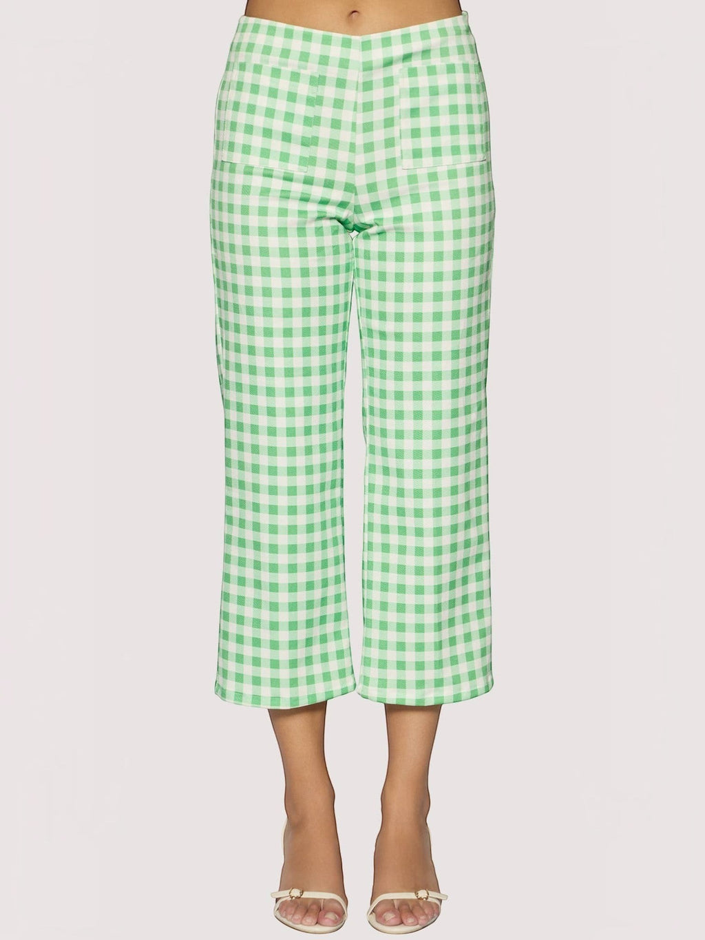 Mialur green and white gingham print cropped capri pants with front patch pockets worn with heeled sandals.