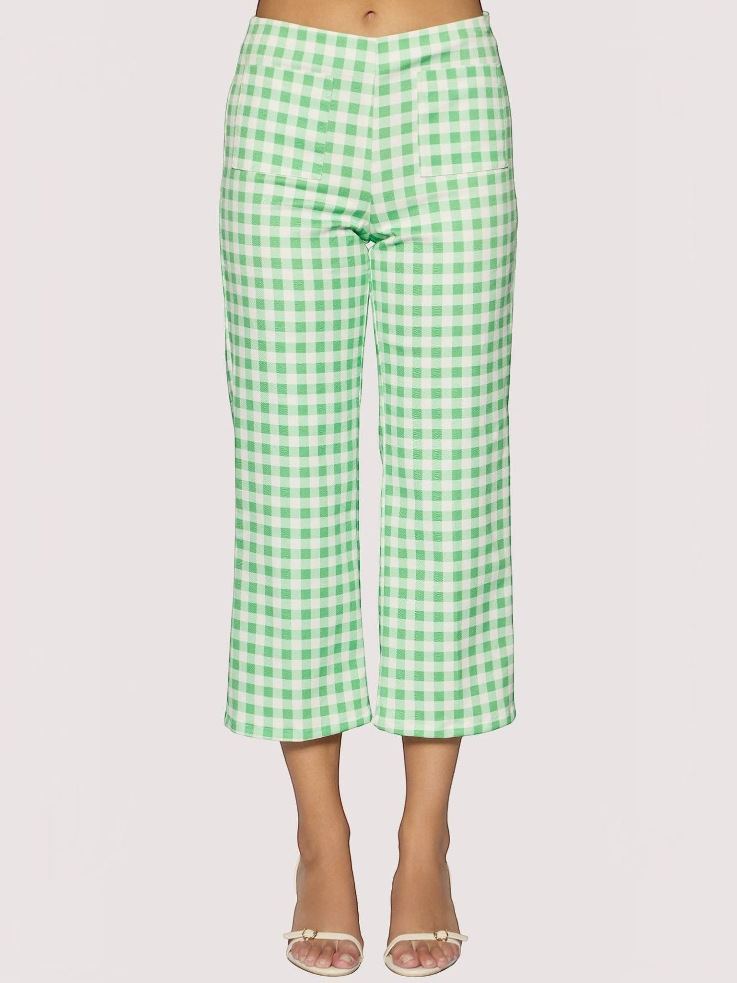 Mialur green and white gingham print cropped capri pants with front patch pockets worn with heeled sandals.