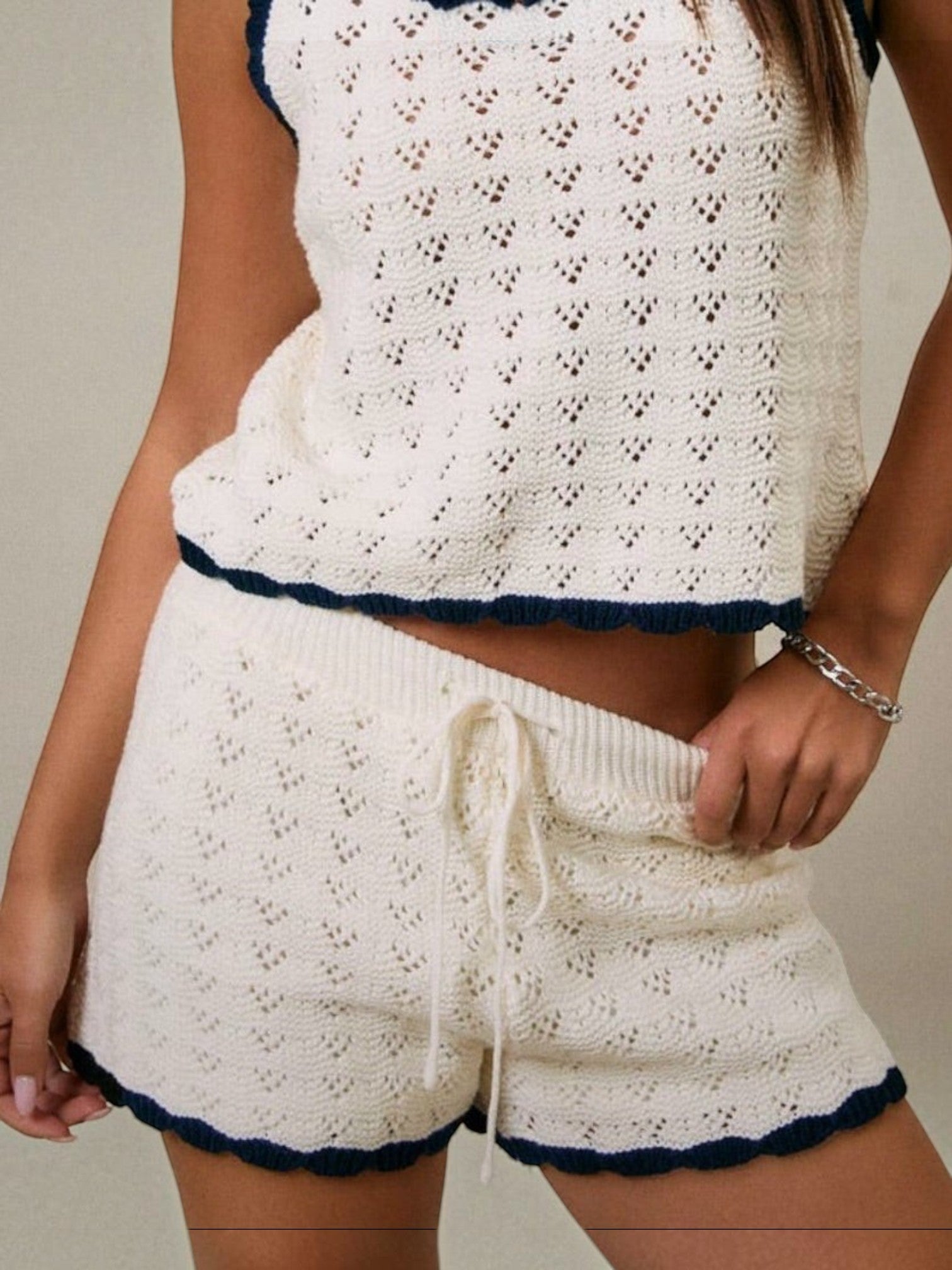 Mialur Harbor Knit Shorts in neutral knit fabric with navy contrast trim and drawstring waist, worn as a matching set.