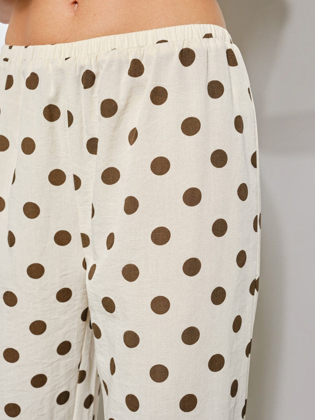 Mialur Harper wide-leg pants in cream with chocolate brown polka dots featuring a comfortable elastic waistband.
