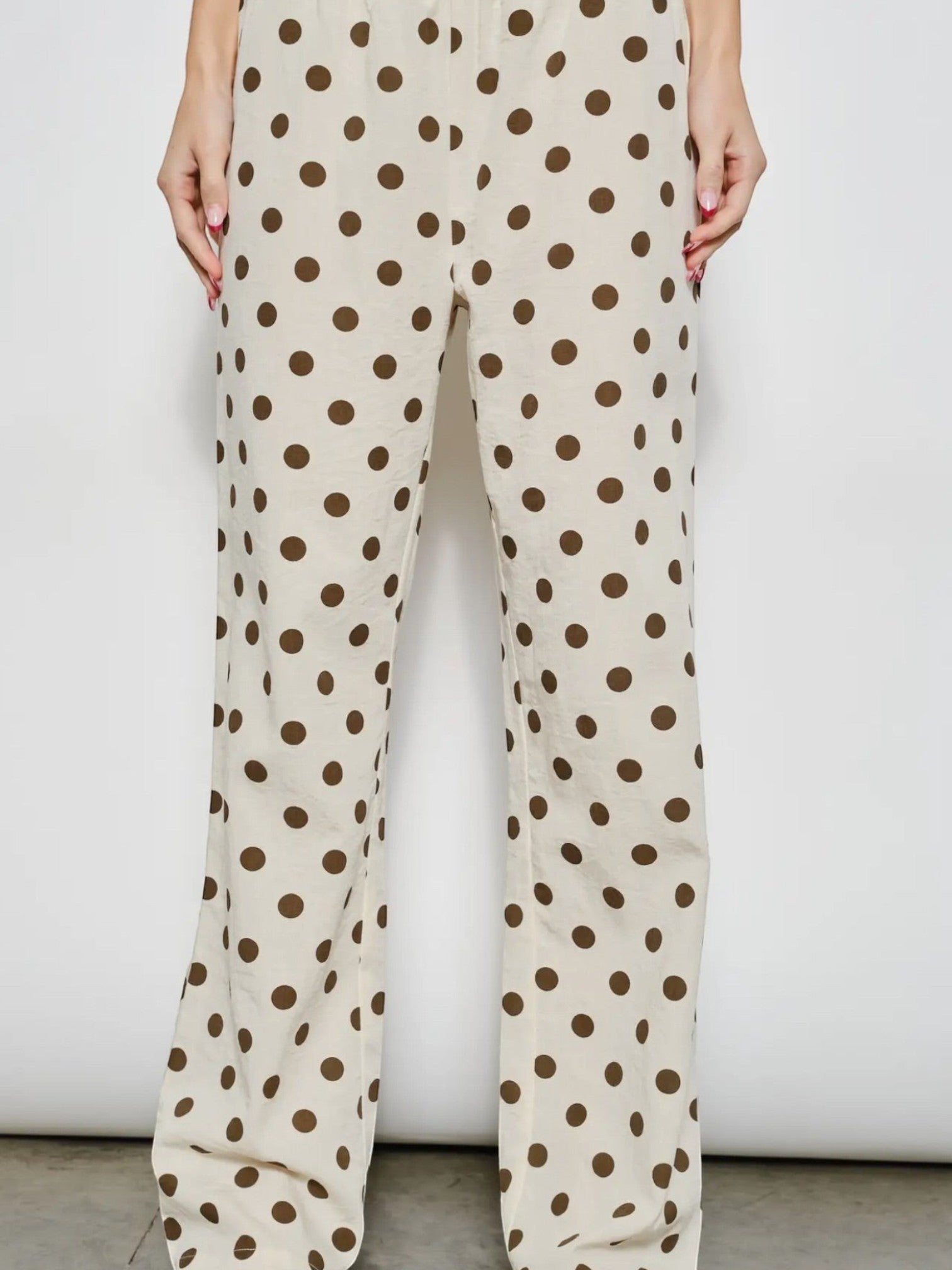 Mialur Harper Polka Dot Pants in cream with chocolate brown dots, featuring a relaxed wide-leg fit and side pockets.