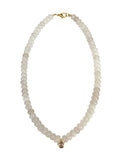 Mialur Isla beaded necklace featuring glossy white beads, a gold-tone CZ teardrop pendant, and a gold clasp.