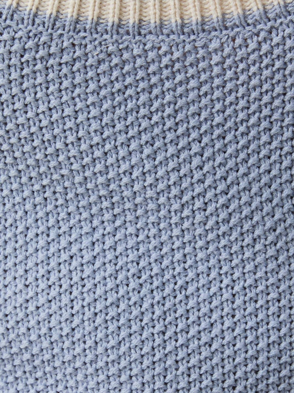 Close-up of Mialur light blue breathable knit fabric with contrast ribbed trim from the Coastal Breeze Mini Dress.