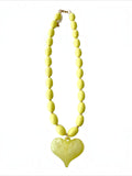 Mialur lime green beaded necklace featuring a glossy heart-shaped pendant and gold-tone clasp hardware.