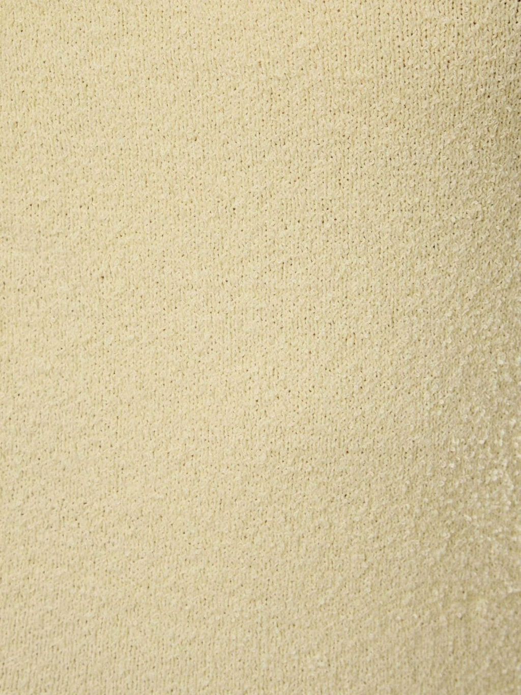 Close-up of the soft limoncello yellow luxury knit fabric of the Mialur Limoncello Knit Midi Dress