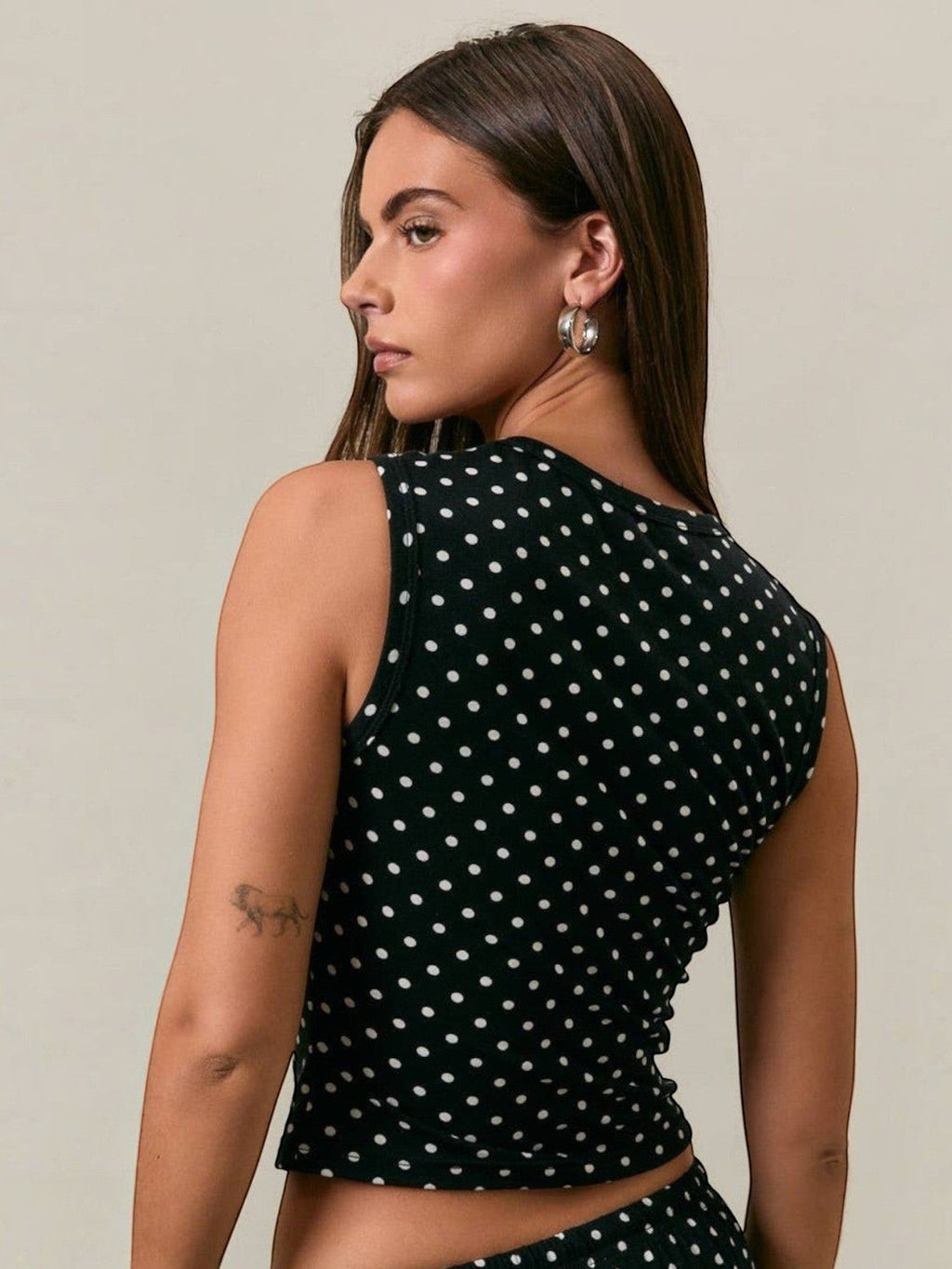 Mialur Luna polka dot tank top in black and white stretch knit with a fitted silhouette and round neckline.