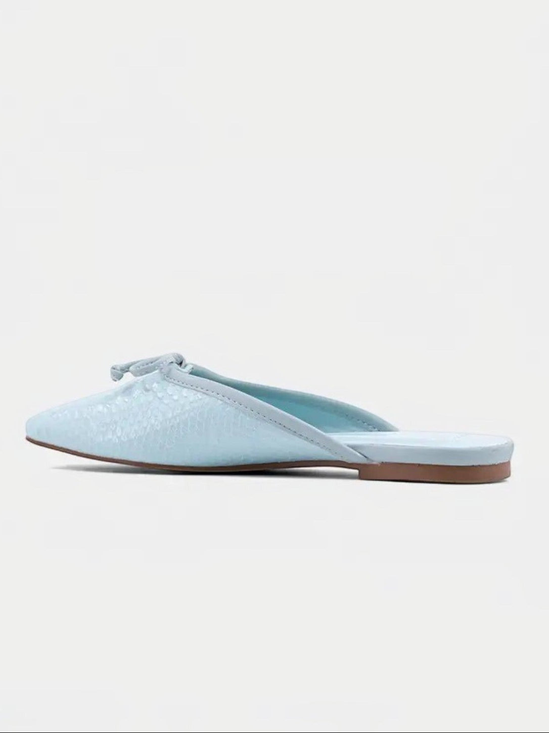 Mialur mint green faux snake leather flats with a delicate bow detail on the toe, shown from a side profile view.
