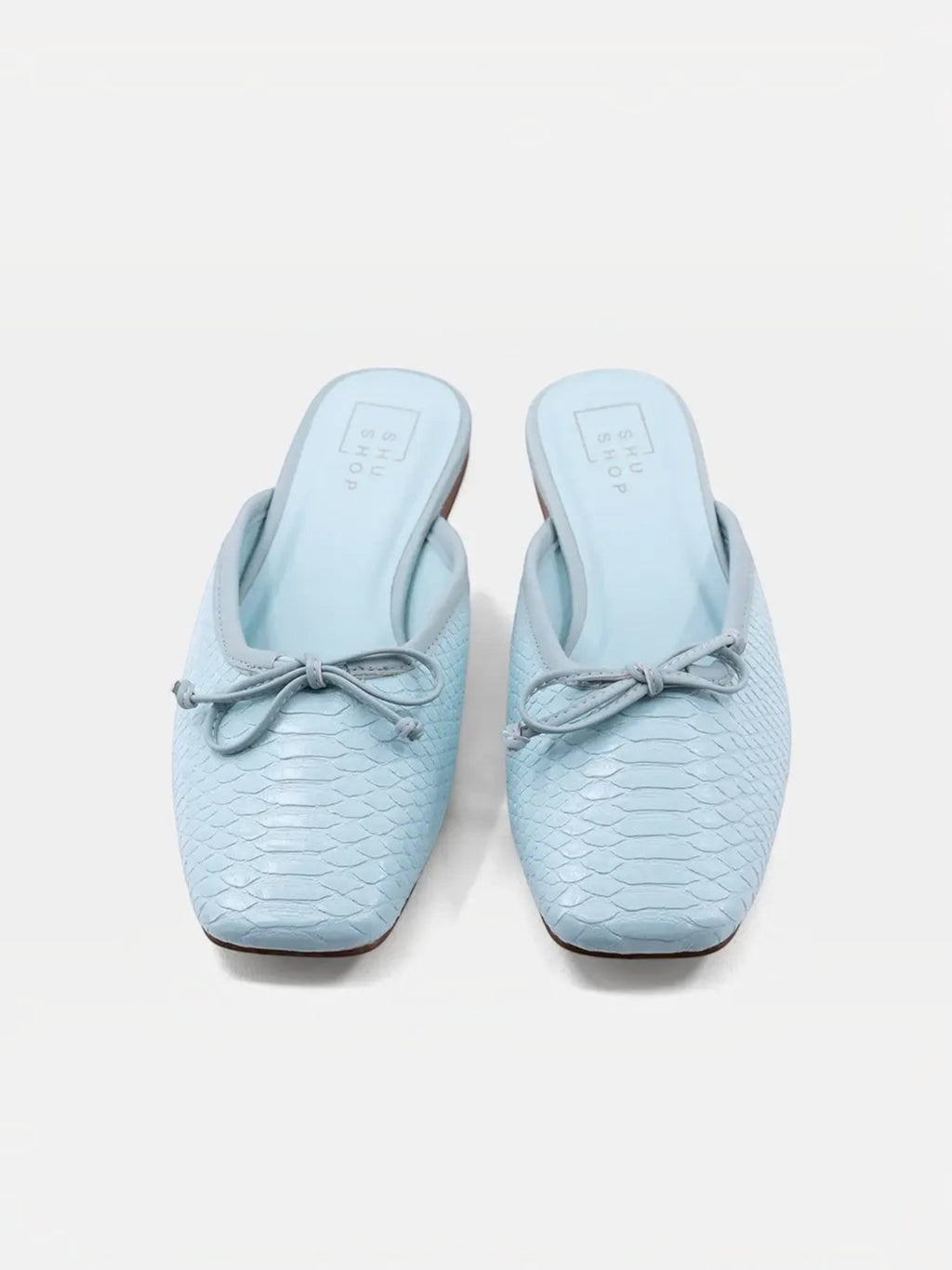 Mialur ANDREA mint green faux snake leather flats with a delicate bow detail on the toe in a classic slip-on style.