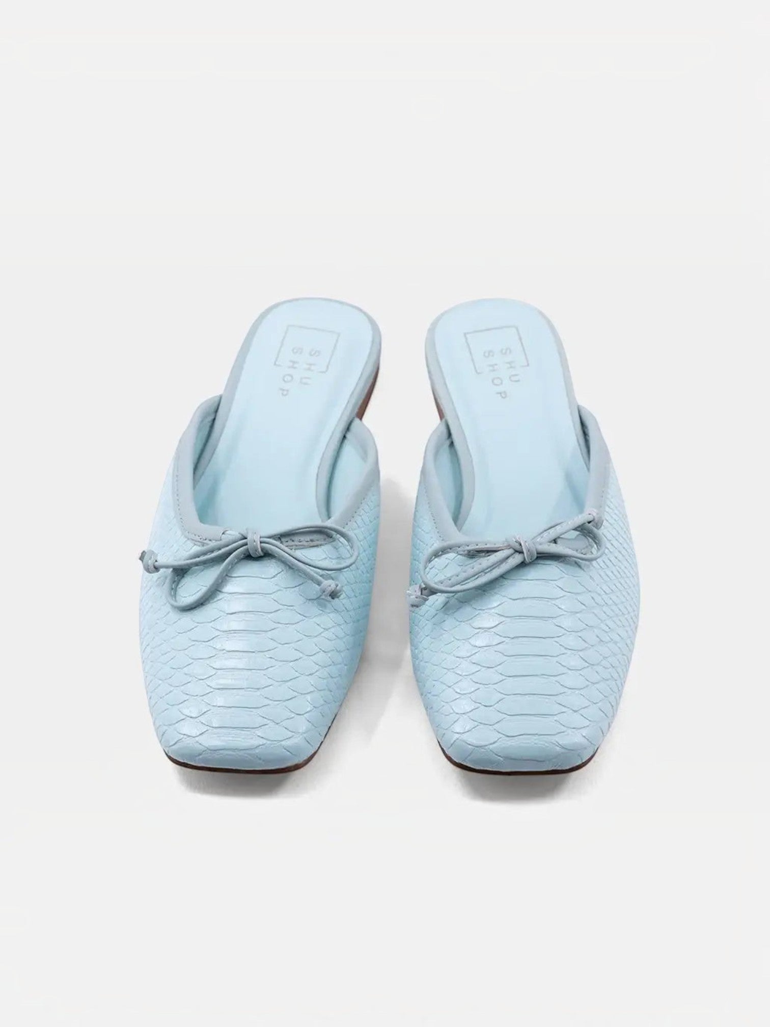 Mialur ANDREA mint green faux snake leather flats with a delicate bow detail on the toe in a classic slip-on style.