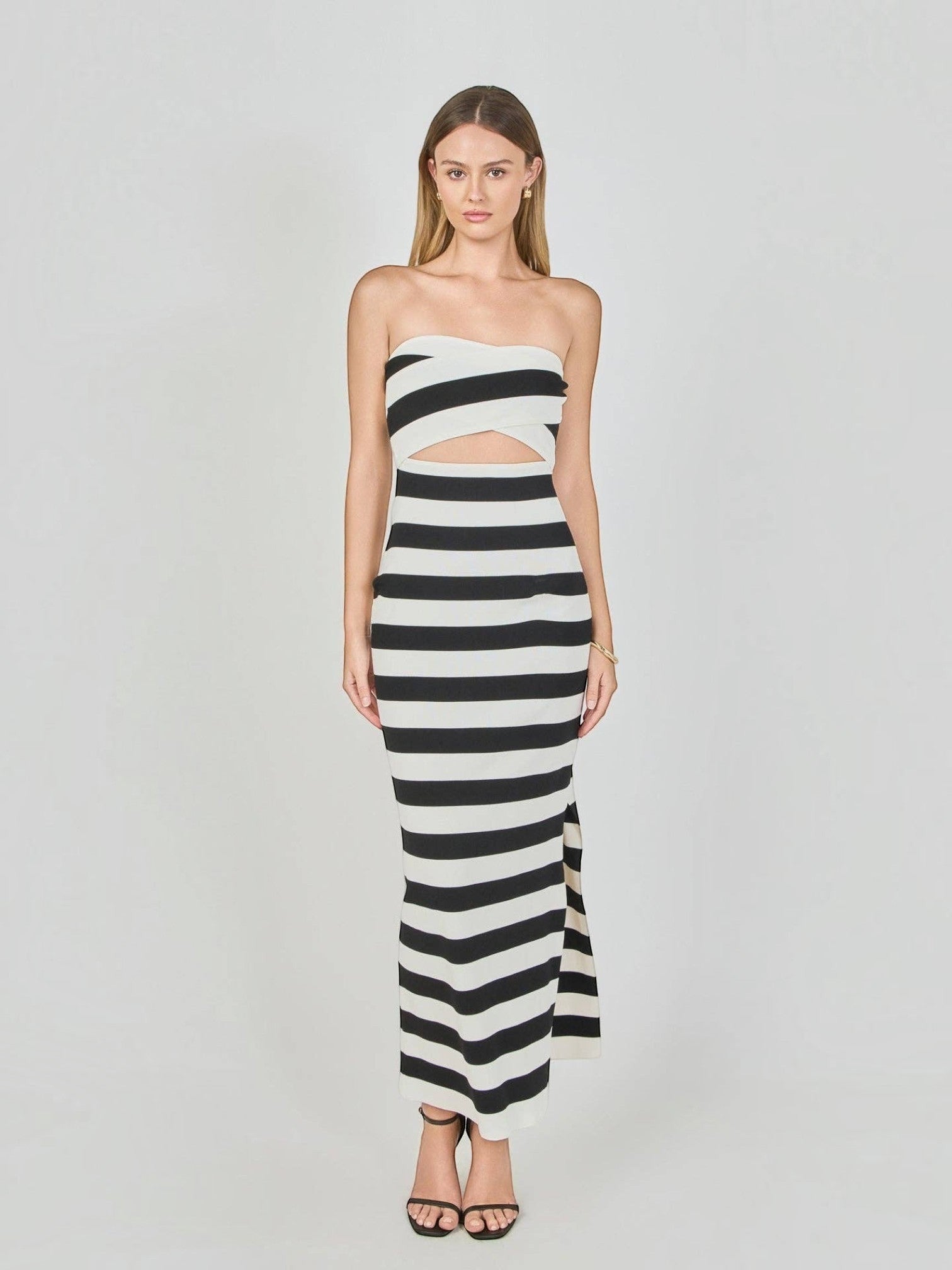 Mialur Monaco stripe maxi dress featuring a strapless neckline, front waist cutout, and black and white horizontal knit.