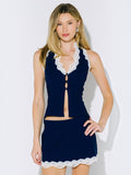 Mialur navy blue halter top featuring delicate white lace trim, button-front closure, and feminine cutout details.