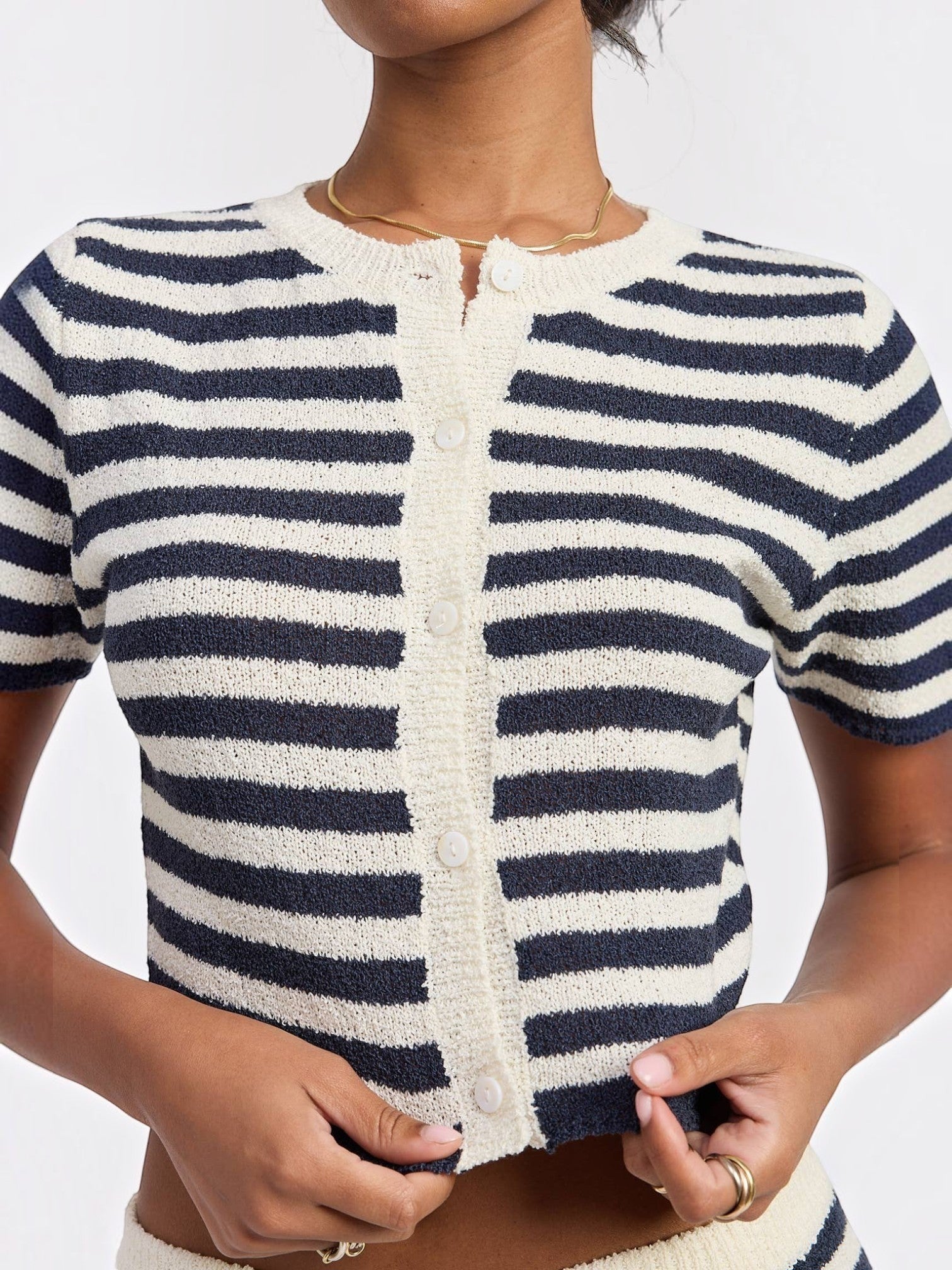 Mialur Navy Coast Knit Top featuring navy and white horizontal stripes, short sleeves, and a white button-front placket.