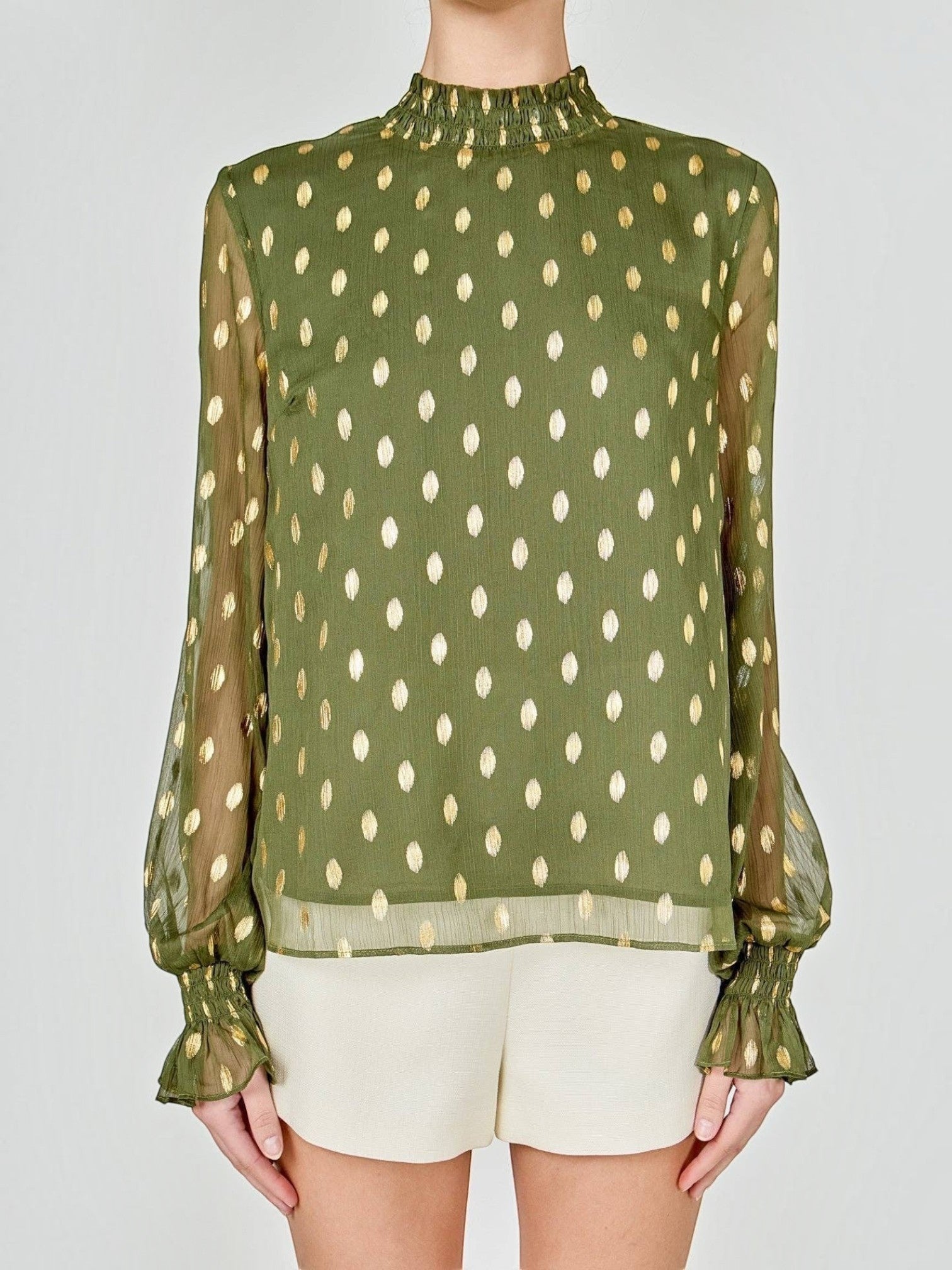 Mialur olive green chiffon blouse with metallic gold polka dots, high ruffled neckline, and ruffle-trimmed cuffs.
