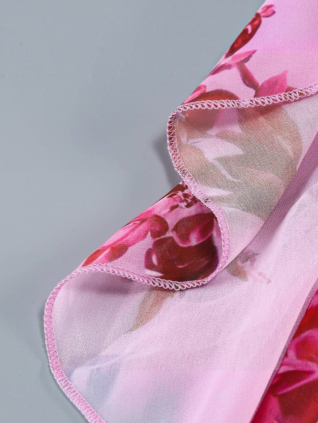 Mialur pink floral maxi dress fabric detail showing cascading ruffle edge with delicate stitching