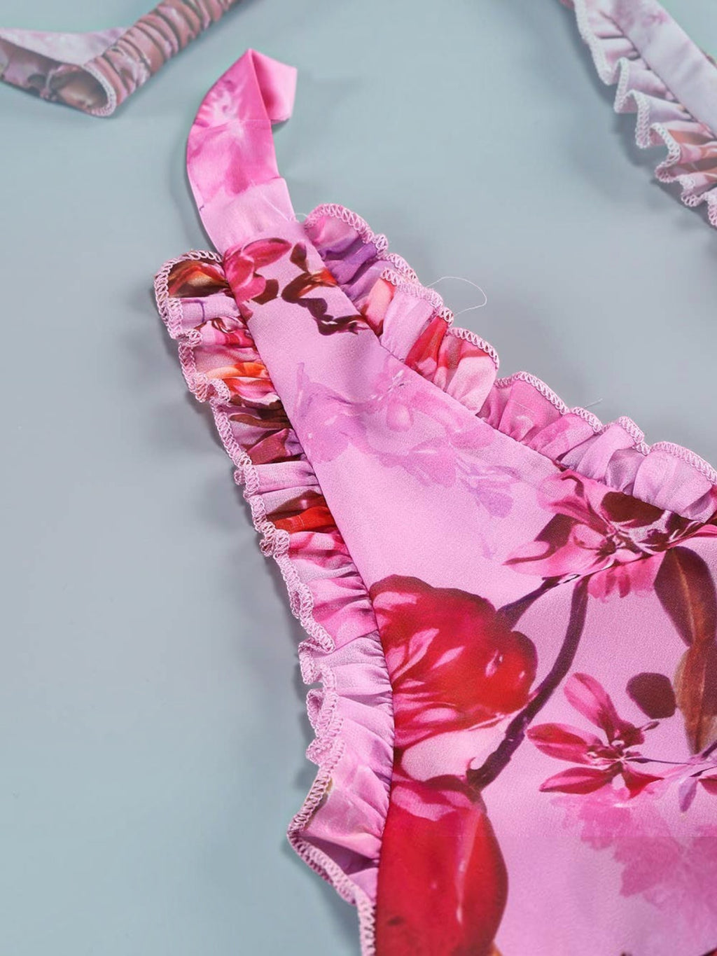 Mialur pink floral maxi dress featuring a halter neckline and delicate cascading ruffle trim details.