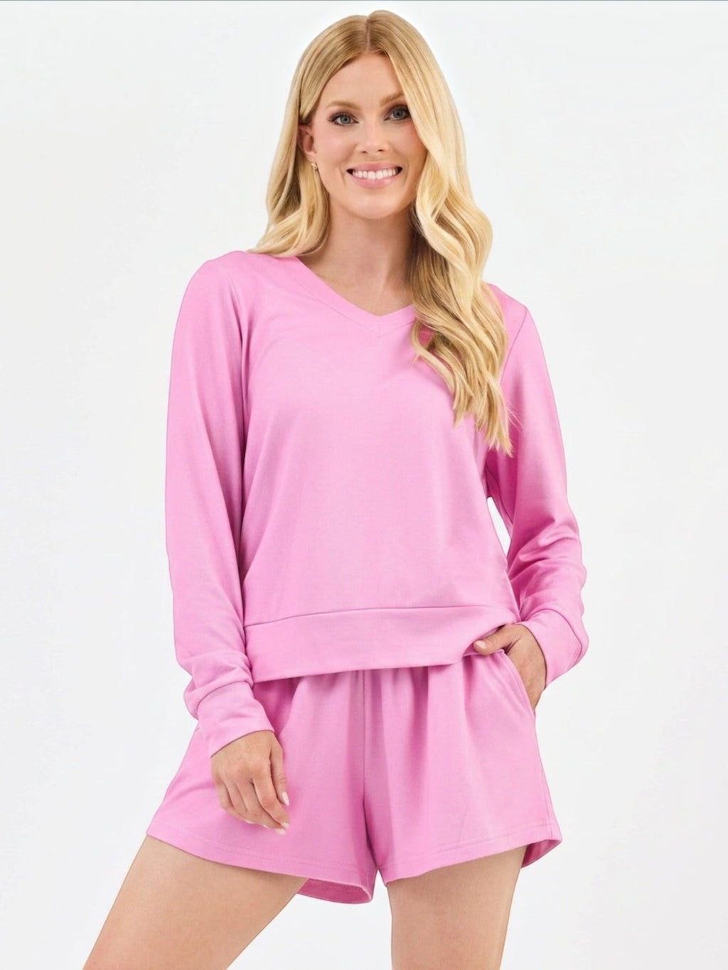 Mialur pink long-sleeve V-neck top and matching shorts set worn by a smiling blonde woman in a relaxed fit.