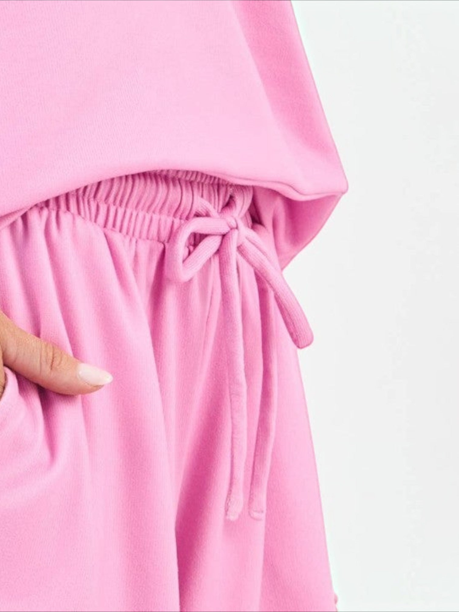 Mialur pink lounge shorts with an elastic drawstring waistband and soft fabric, shown in a close-up view.