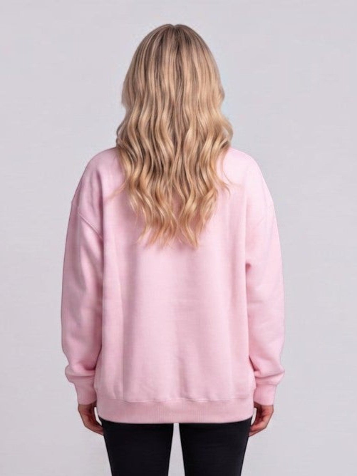 Back view of a woman wearing a Mialur pink relaxed-fit cotton-blend sweatshirt with long sleeves.