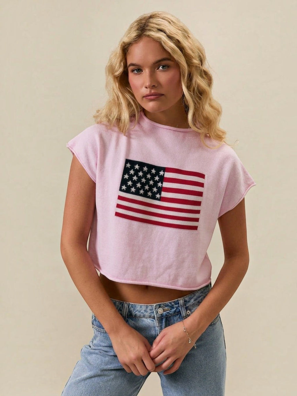 Mialur pink mock neck top with American flag graphic and relaxed drop shoulder fit worn by a blonde model