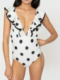 Mialur black and white polka dot one-piece swimsuit with a plunging V-neckline and feminine ruffle shoulder trim.