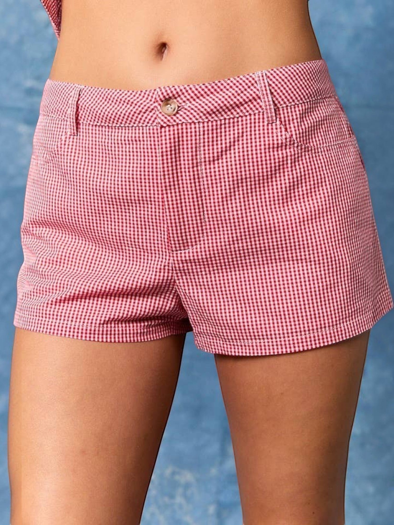 Mialur red and white micro gingham shorts with a button-front waistband for a feminine summer look.