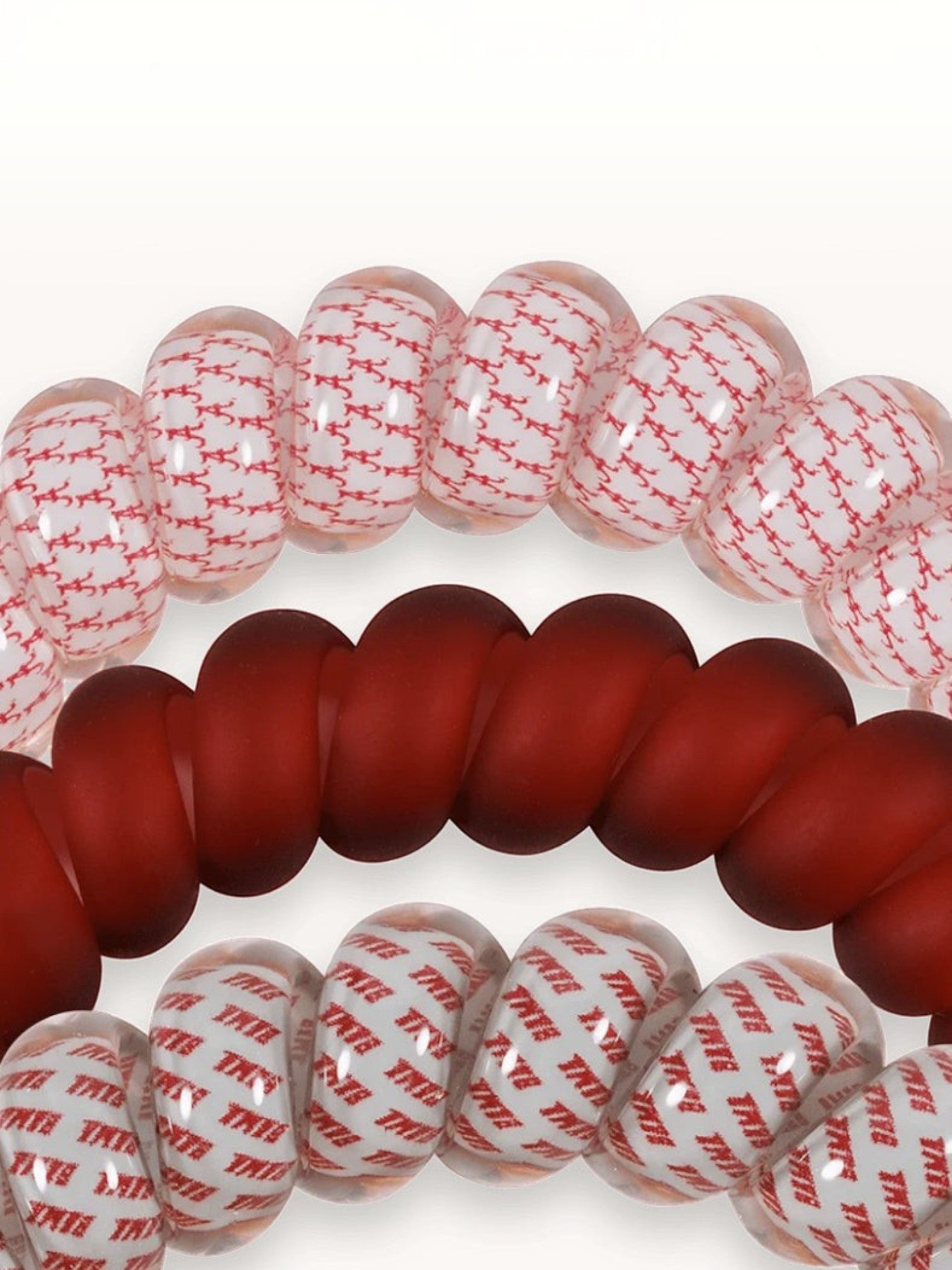 Mialur Roll Tide hair ties in crimson and white spiral designs, durable and gentle coil accessories for all hair types.