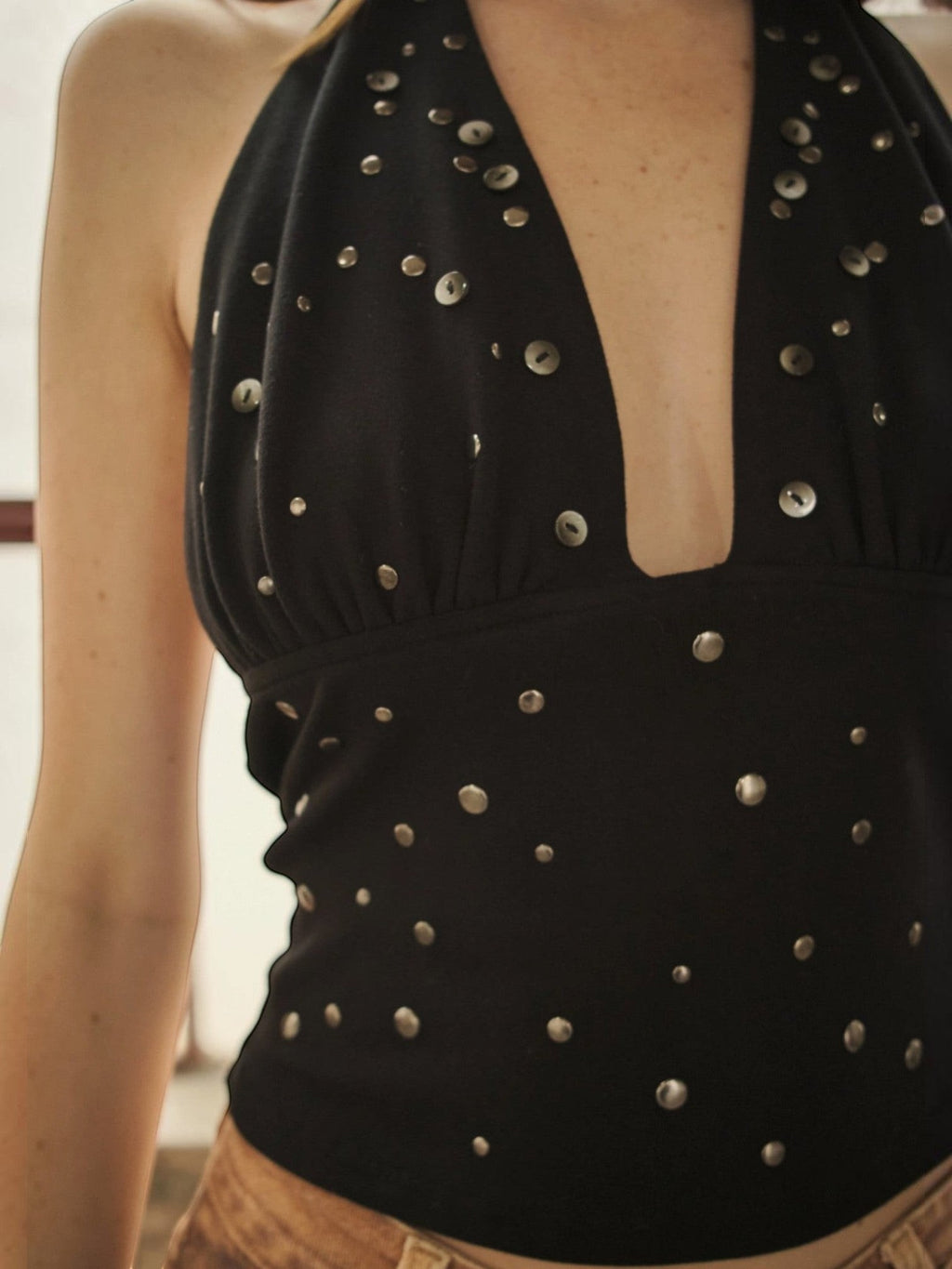 Mialur Roxie Halter black fitted top with deep plunge neckline and scattered metal stud embellishments
