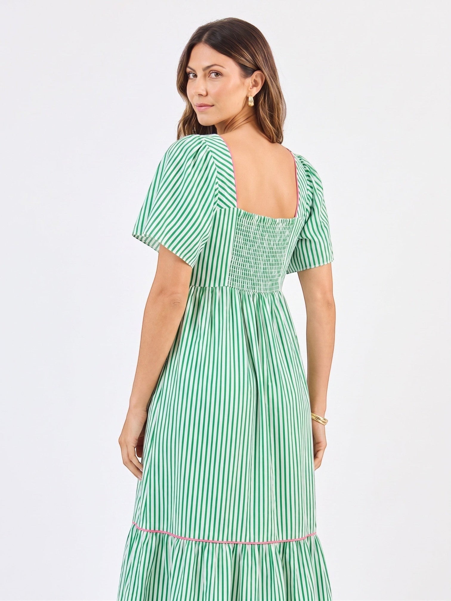 Model wearing Mialur Savannah green and white striped midi dress with square neckline and puff sleeves, back view
