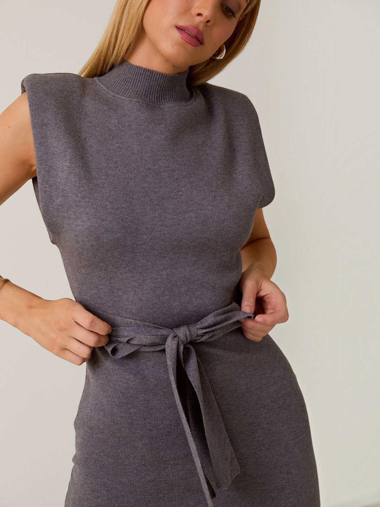 Mialur Sloane chocolate brown knit mini dress with mock neck, structured shoulders, and a self-tie waist belt.