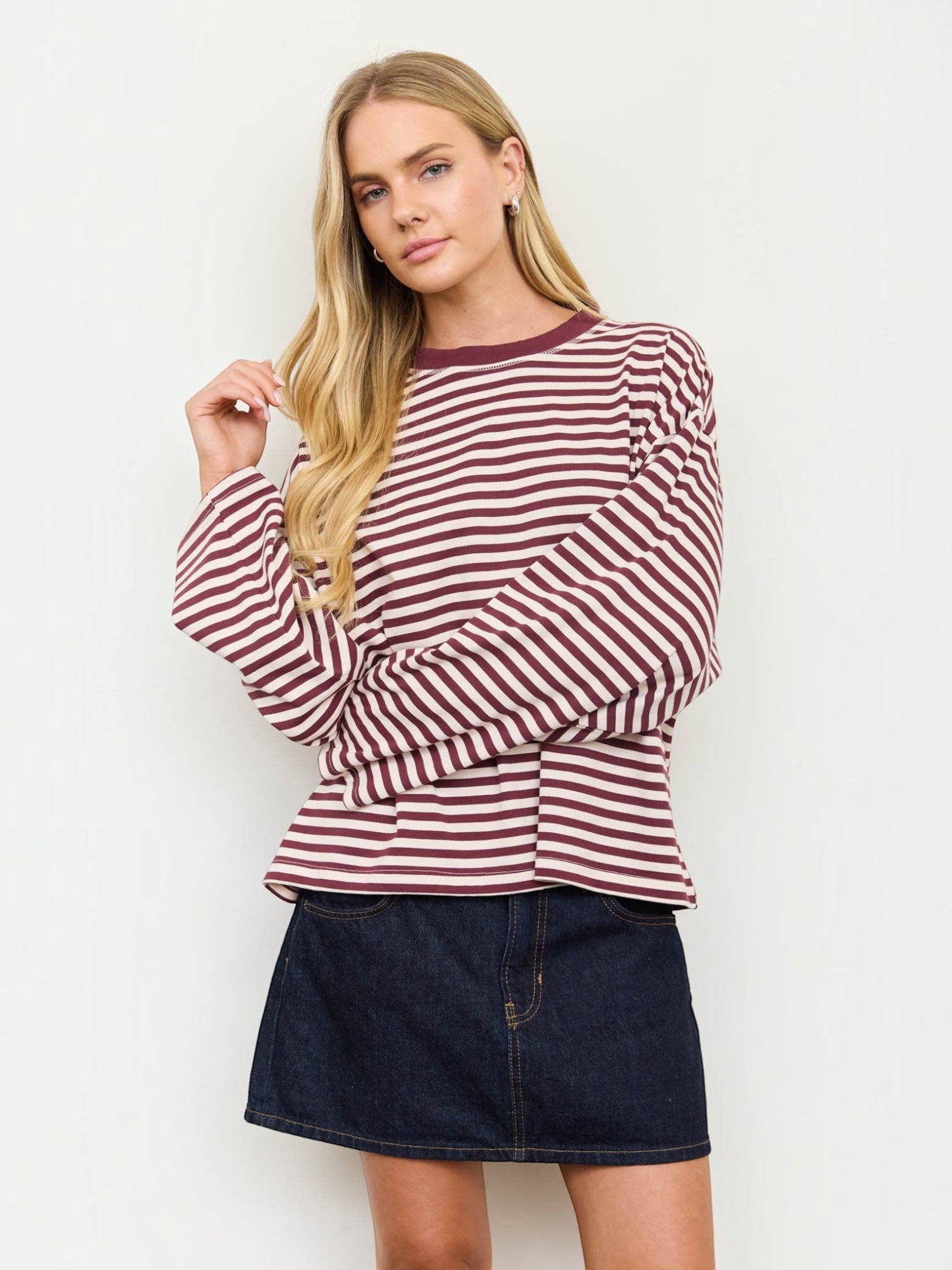 Mialur long-sleeve striped crew neck top with drop shoulders and contrast trim worn by a blonde model with a denim skirt
